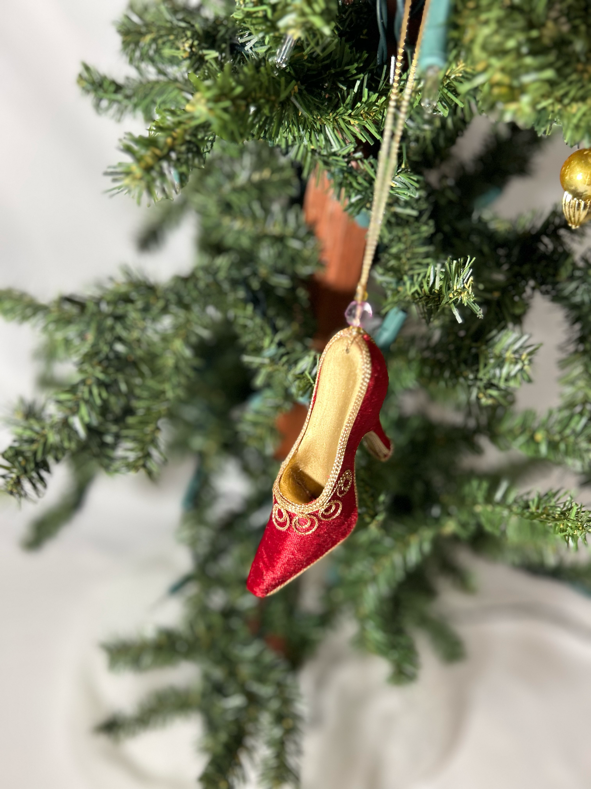 Red velvet heel with gold embroidered threading